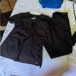 Two black Barco scrub sets